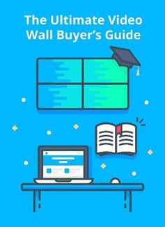 The Ultimate Video Wall Buyer's Guide, gráfico de videowall con gorra de graduación, y un escritorio con ordenador portátil y ratón, y libro
